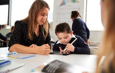 Teacher working with student