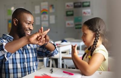 Man teaching girl