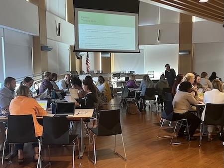 People sitting at tables at a conference